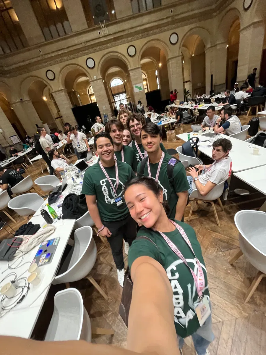 Samuel Schmitt with builders at a hackathon venue in Paris
