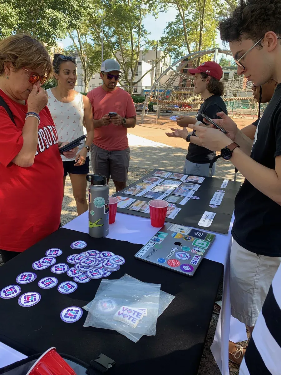 Quae table with stickers and outreach materials
